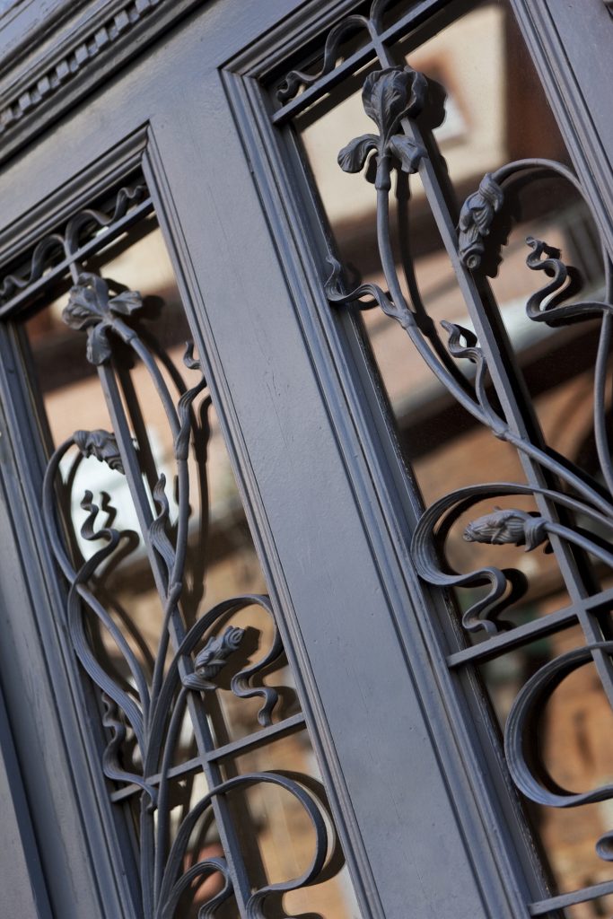 Close up of a vintage wrought iron door of a French house