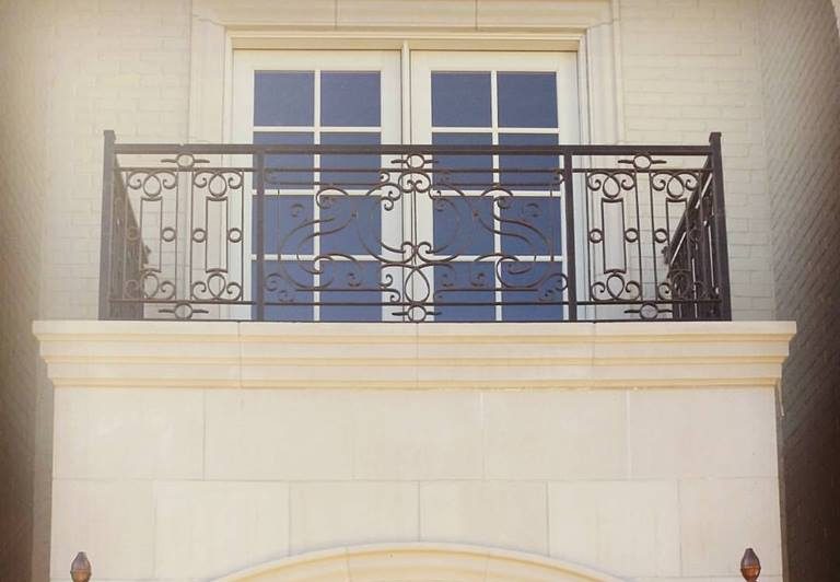 balcony with wrought iron railing